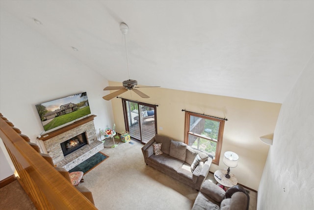 11104 Southbrook Dr, Ceresco, MI 49033 - carpeted living area with lofted ceiling, a glass covered fireplace, and a ceiling fan