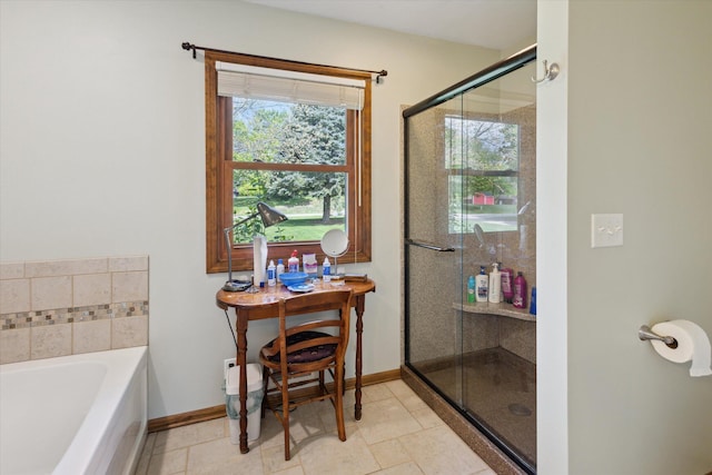 11104 Southbrook Dr, Ceresco, MI 49033 - full bath featuring a bath, a shower stall, and baseboards