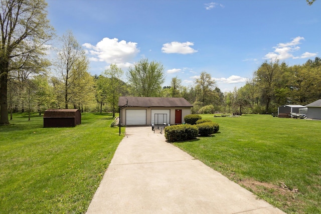 11104 Southbrook Dr, Ceresco, MI 49033 - view of green lawn with a garage and an outdoor structure