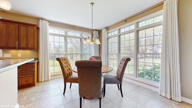 7272 Holden Rd, Stevensville, MI 49127 - dining room with an inviting chandelier, baseboards, and light tile patterned flooring