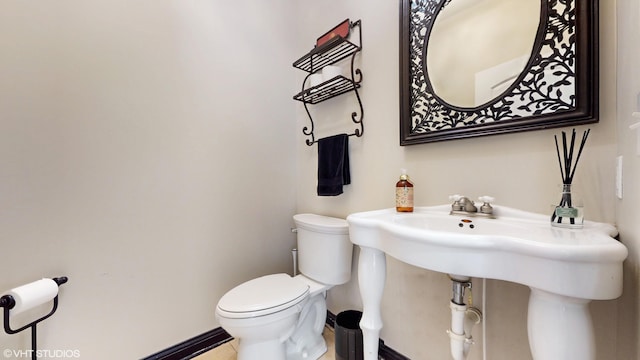 7272 Holden Rd, Stevensville, MI 49127 - bathroom featuring toilet and baseboards