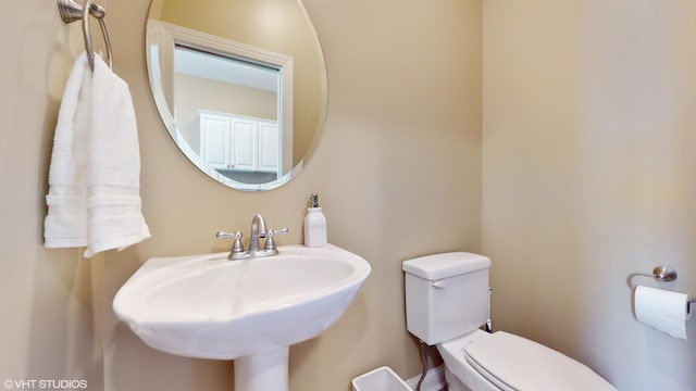 7272 Holden Rd, Stevensville, MI 49127 - half bathroom featuring a sink and toilet