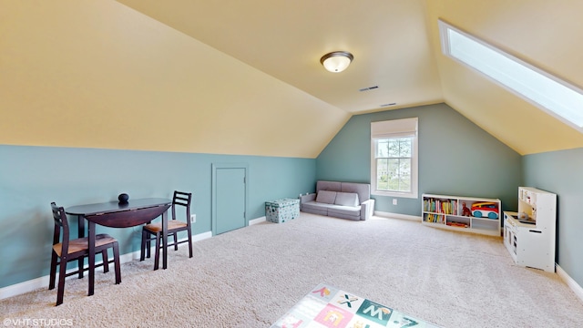 7272 Holden Rd, Stevensville, MI 49127 - game room featuring lofted ceiling with skylight, carpet floors, baseboards, and visible vents