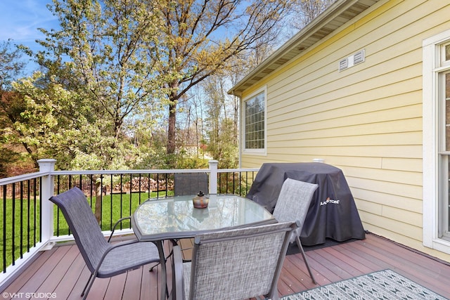 7272 Holden Rd, Stevensville, MI 49127 - wooden terrace with a grill and outdoor dining space