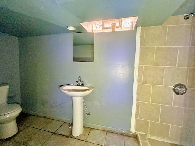 16476 Rossini Dr, Detroit, MI 48205 - bathroom featuring walk in shower, tile patterned flooring, toilet, and a sink