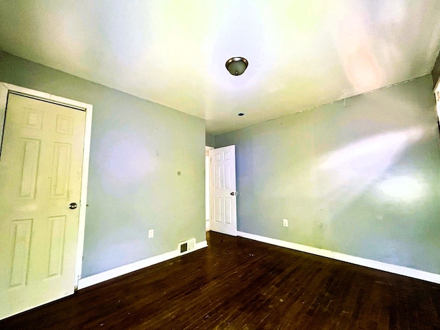 16476 Rossini Dr, Detroit, MI 48205 - empty room with baseboards, visible vents, and wood-type flooring