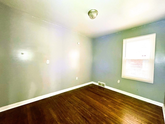 16476 Rossini Dr, Detroit, MI 48205 - empty room featuring visible vents, wood finished floors, and baseboards