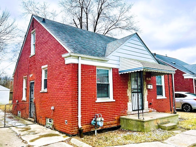 16476 Rossini Dr, Detroit, MI 48205 - bungalow featuring a shingled roof and brick siding