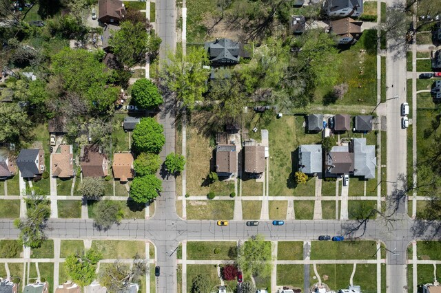 birds eye view of property with a residential view