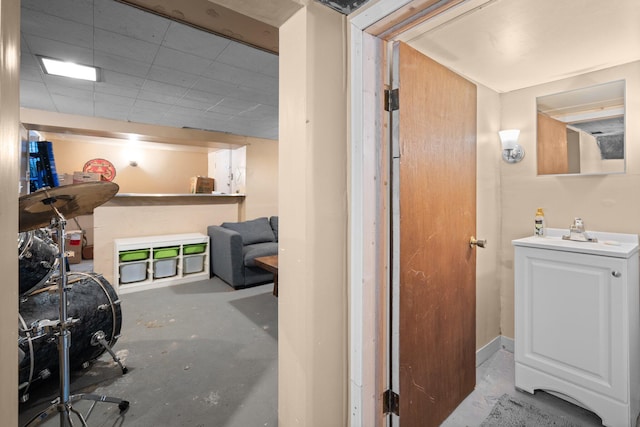 interior space featuring a sink and unfinished concrete flooring