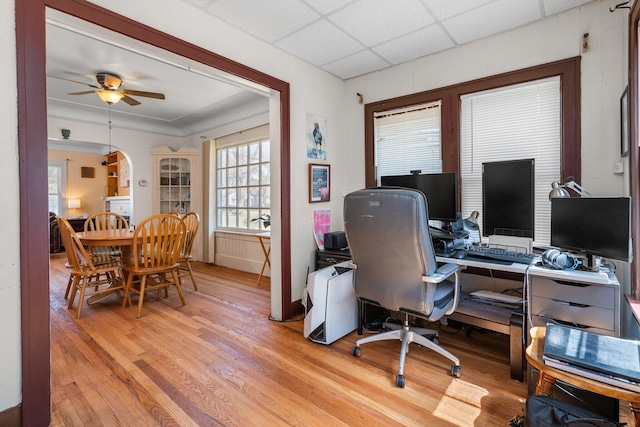 office space with light wood finished floors and ceiling fan