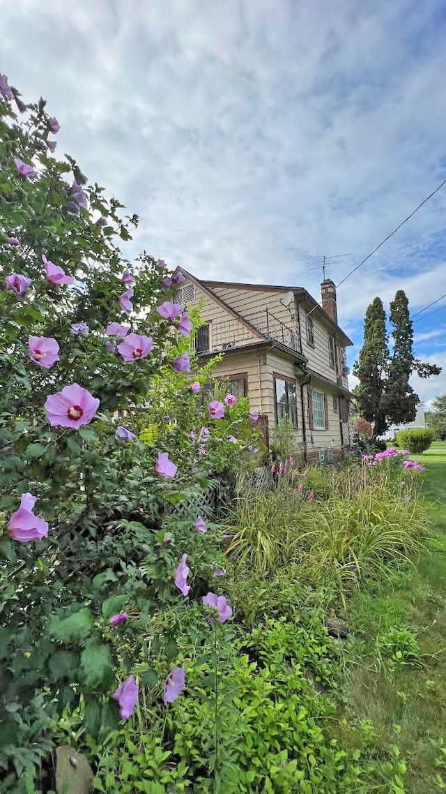 view of home's exterior with a chimney