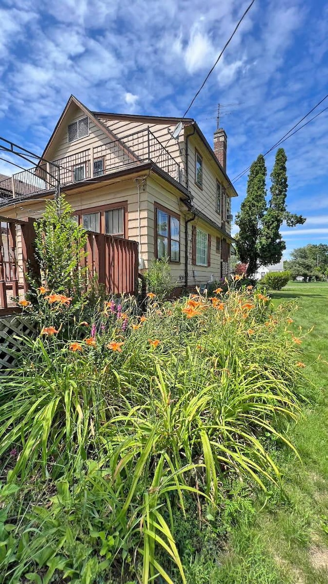 view of side of property featuring a chimney