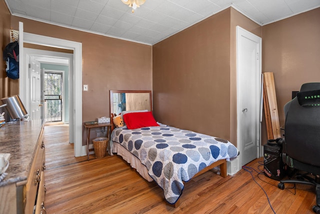 18511 Margareta St, Detroit, MI 48219 - bedroom with light wood-style flooring and crown molding