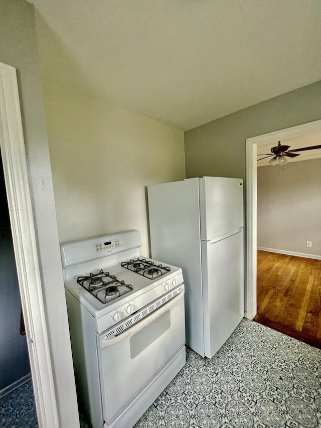 kitchen featuring white appliances and ceiling fan