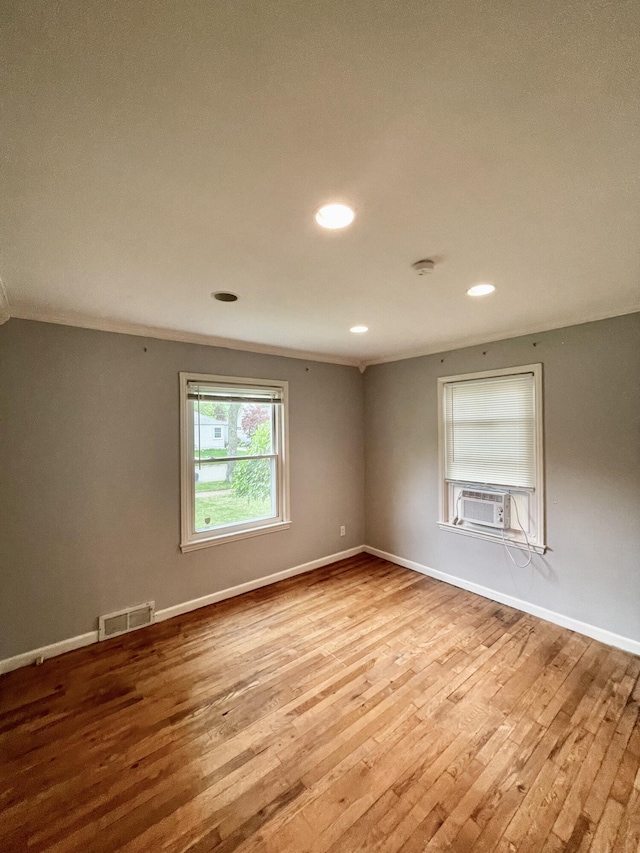 2575 Ellwood Ave, Berkley, MI 48072 - spare room with hardwood / wood-style flooring, cooling unit, baseboards, and recessed lighting