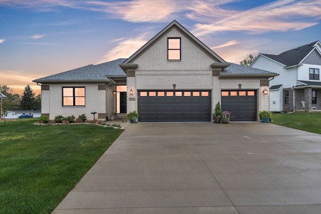 3166 Roma, Wixom, MI 48393 - view of front of home with brick siding, concrete driveway, an attached garage, and a yard