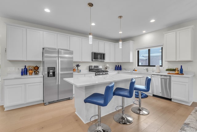 3166 Roma, Wixom, MI 48393 - kitchen featuring stainless steel appliances, light wood finished floors, white cabinetry, and recessed lighting