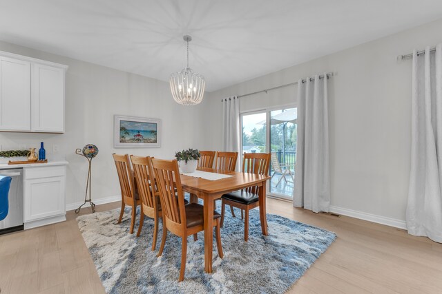 3166 Roma, Wixom, MI 48393 - dining space featuring a chandelier, baseboards, and light wood-style flooring