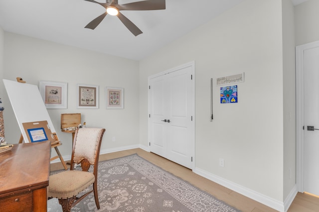 3166 Roma, Wixom, MI 48393 - office area with a ceiling fan, baseboards, and light wood finished floors