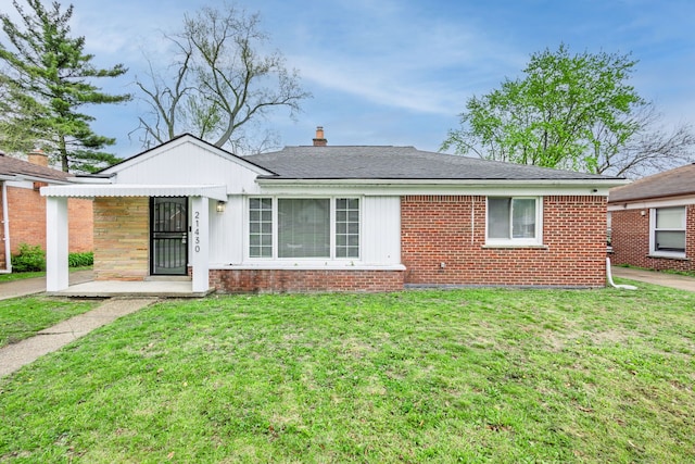 21430 Ridgedale St, Oak Park, MI 48237 - single story home with brick siding, a front lawn, and a chimney