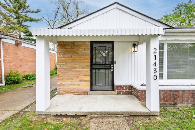 21430 Ridgedale St, Oak Park, MI 48237 - view of exterior entry featuring board and batten siding