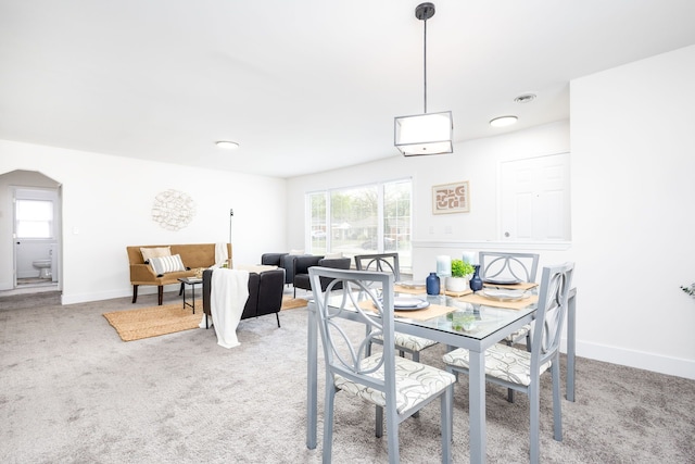 21430 Ridgedale St, Oak Park, MI 48237 - dining space featuring plenty of natural light, light carpet, baseboards, and arched walkways