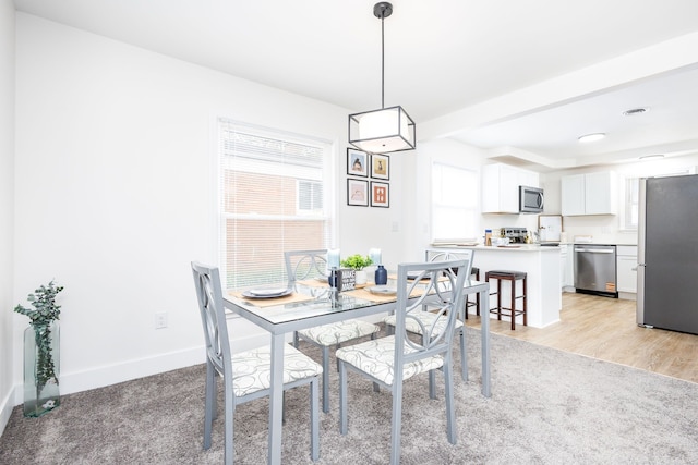 21430 Ridgedale St, Oak Park, MI 48237 - dining space with light wood-style flooring and baseboards