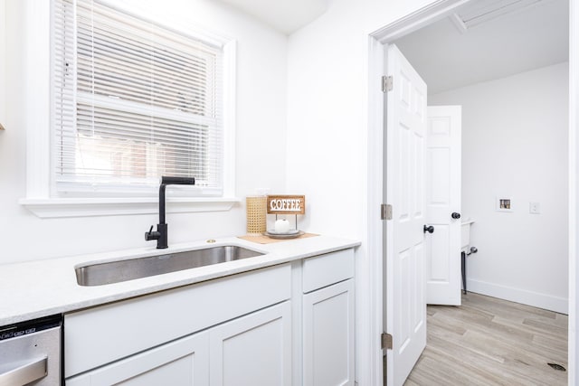 21430 Ridgedale St, Oak Park, MI 48237 - washroom featuring light wood-type flooring, washer hookup, and baseboards