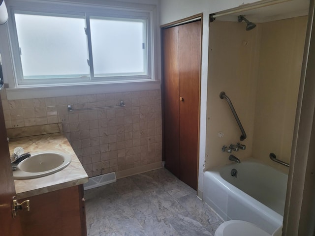 bathroom with vanity, shower / bathtub combination, and visible vents