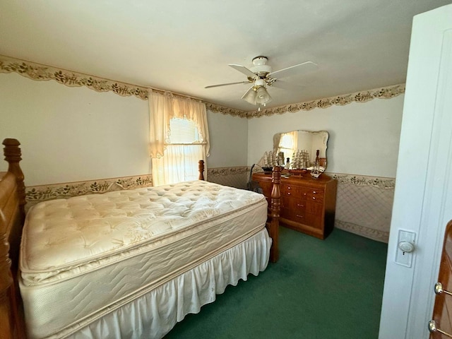 bedroom with a ceiling fan and carpet