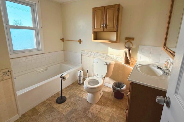 full bath with toilet, a garden tub, and vanity