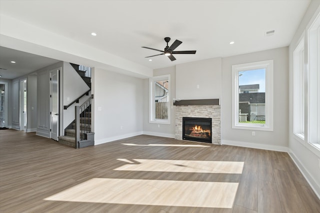 45518 Jefferson Ave, Chesterfield, MI 48047 - unfurnished living room featuring a fireplace, wood finished floors, healthy amount of natural light, a ceiling fan, and recessed lighting