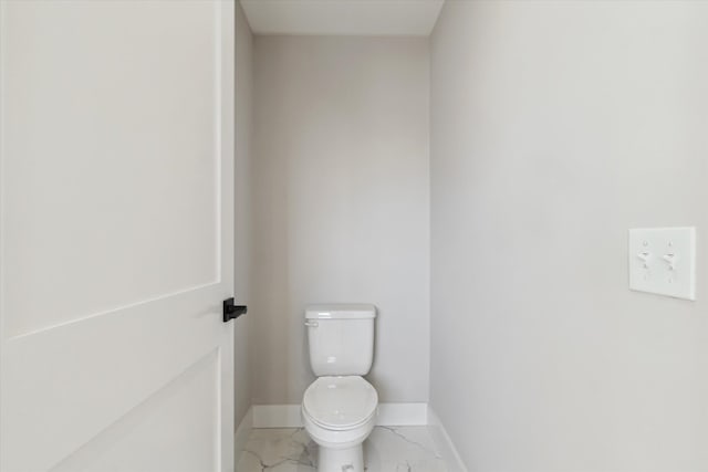 45518 Jefferson Ave, Chesterfield, MI 48047 - bathroom featuring marble look tiles, baseboards, and toilet