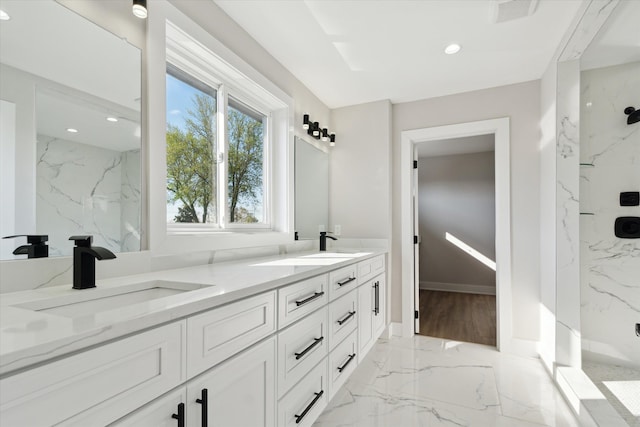 45518 Jefferson Ave, Chesterfield, MI 48047 - bathroom featuring marble tiled flooring, double vanity, a marble finish shower, recessed lighting, and baseboards