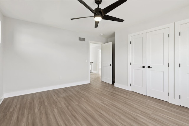 45518 Jefferson Ave, Chesterfield, MI 48047 - unfurnished bedroom with light wood-style floors, baseboards, and ceiling fan