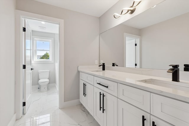 45518 Jefferson Ave, Chesterfield, MI 48047 - bathroom featuring baseboards, toilet, marble finish floors, and double vanity