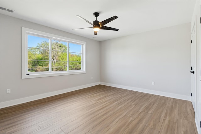 45518 Jefferson Ave, Chesterfield, MI 48047 - empty room with light wood-style flooring, ceiling fan, and baseboards