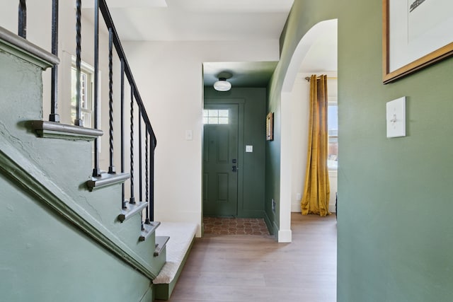 18941 Santa Rosa Dr, Detroit, MI 48221 - entrance foyer featuring wood finished floors, stairway, arched walkways, and baseboards