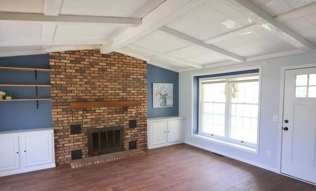 unfurnished living room featuring dark wood-type flooring, a fireplace, and baseboards