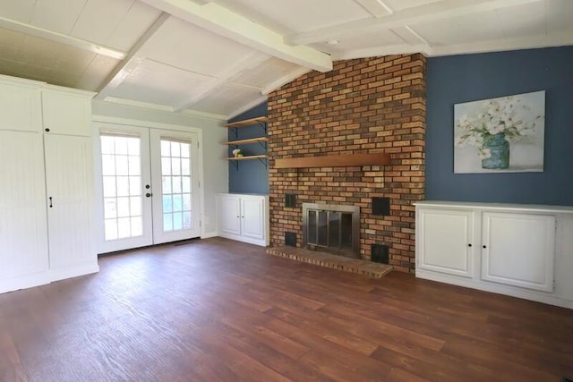 unfurnished living room with wood finished floors, french doors, and a brick fireplace