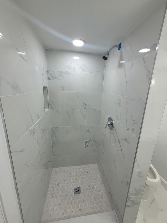 9340 Mansfield St, Detroit, MI 48228 - bathroom with a stall shower and marble look tile flooring