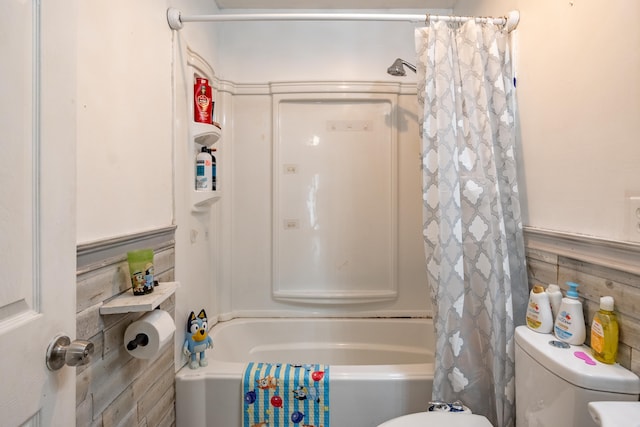 bathroom with toilet and shower / bath combo with shower curtain