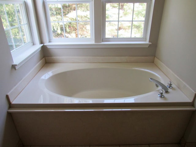 full bathroom with a bath