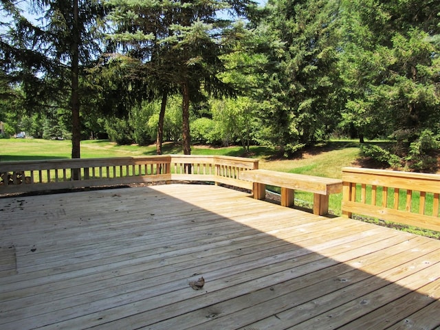 wooden deck with a yard
