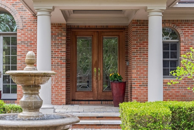 230 Corrie Rd, Ann Arbor, MI 48105 - view of exterior entry with french doors and brick siding