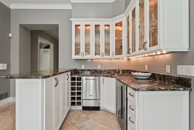 230 Corrie Rd, Ann Arbor, MI 48105 - bar area featuring beverage cooler, light tile patterned floors, ornamental molding, and dishwasher