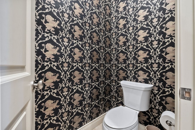 230 Corrie Rd, Ann Arbor, MI 48105 - bathroom featuring toilet, wallpapered walls, and baseboards