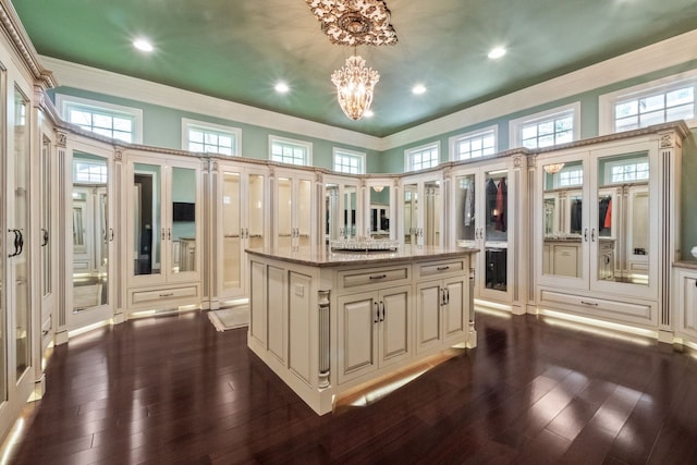 230 Corrie Rd, Ann Arbor, MI 48105 - walk in closet featuring a chandelier, dark wood finished floors, and a towering ceiling
