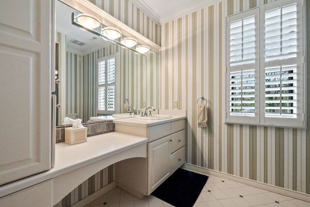 230 Corrie Rd, Ann Arbor, MI 48105 - bathroom featuring plenty of natural light, wallpapered walls, crown molding, vanity, and baseboards